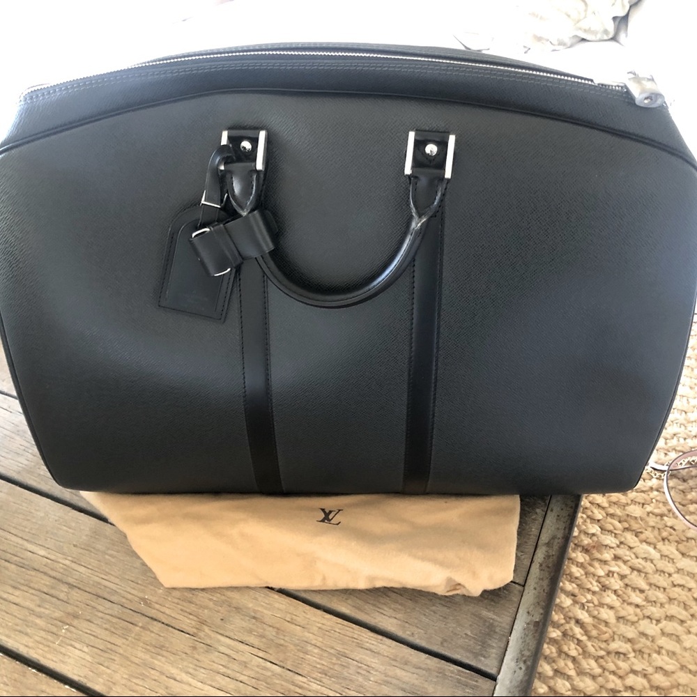 Louis Vuitton hard-sided travel bag